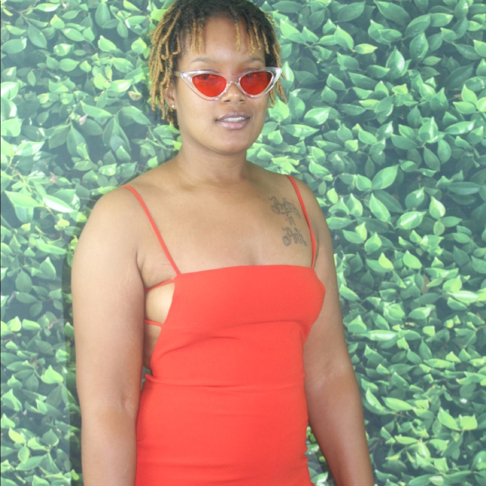 Forever 21 Red “barely there” open back jumpsuit.